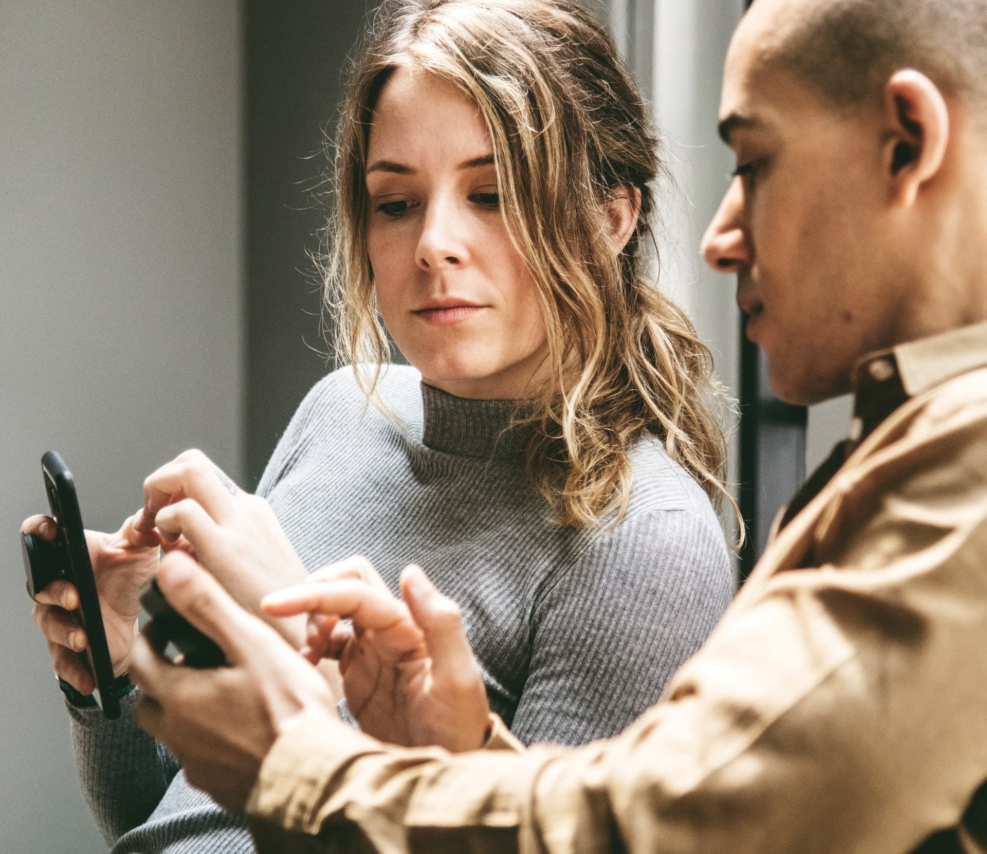 two people looking at mobile phone