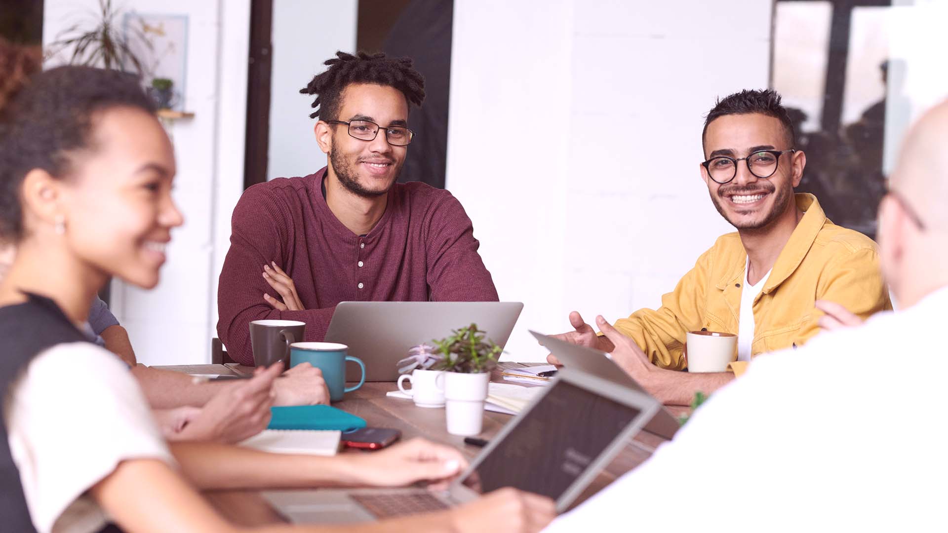 digital marketing team smiling and having a discussion